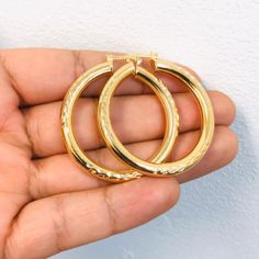 Material: 14k Gold Filled Measurements: 1.8x1.6 Inches Thickness: 5mm Classic Cadmium-free Yellow Gold Jewelry, Gold Hoop Earrings Stamped 14k For Wedding, Gold Jewelry With Shiny Finish, Gold Round Jewelry With Shiny Finish, Cadmium-free Gold Hoop Jewelry, Gold Jewelry With Shiny Finish For Anniversary, Yellow Hoop Earrings As Gift, Gold 14k Stamped Hoop Earrings For Wedding, Gold 14k Stamped Hoop Earrings As Gift