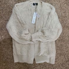 Beautiful Off White Chunky Knit Cardigan. Ordered But Is Just Too Thick For Me In Fl. Has A Fuzzy Feel. Trendy Cream Knit Sweater Coat, Trendy Cable Knit Cream Outerwear, Trendy Cream Cable Knit Outerwear, Trendy Cream Knit Cardigan, Trendy Cream Knitted Cardigan, Trendy Knitted Cream Cardigan, Spring Cable Knit Acrylic Cardigan, Spring Acrylic Cable Knit Cardigan, White Trendy Acrylic Cardigan