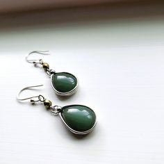 If you're on the hunt for a special gift for Mom, these sage green glass earrings for women are an adorable choice! They feature pretty glass dangle earrings that sway gently with every move, and the soft sage green color feels so fresh and trendy. Plus, with Sterling Silver ear wires, they're lightweight and easy to wear. trust me, this would make a delightful birthday gift for mother that she'll cherish and love wearing every day! I make these in several different colors. Love the subtle hues. I am one of those makers that hoards beads and then seldom adds them to my work. I should seek help but I am trying to incorporate more beads so maybe we can hold off on the therapist for the time being. * Dangle Earrings: 2 inch drop from lobe x 5/8 inch W * Shiny Silver Finish * Faceted Czech bea Birthday Gift For Mother, The Therapist, Special Gifts For Mom, Mother Birthday Gifts, Gift For Mother, Pretty Earrings, Glass Earrings, Shiny Silver, Earrings Sterling Silver