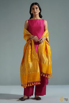 "A timeless dupatta with a mantra handwoven in elegant golden zari. Raw and beautiful - so appealing in its textured appearance and perfect in its imperfections!\n\n\n\n Color\u00a0- A beautiful shade of Mustard with the textured appeal of natural fabric.\n\n\n Technique\u00a0- Classic handwoven Banarasi art passed down through generations\n\n Fabric\u00a0- Textured in appearance, pure Dupion silk\n\n\n Speciality\u00a0- An unusual script pattern, chic and traditional at the same time.\n\n Tilfi Dupatta Styling, Outfit Ideaa, Stylish Kurtis Design, Lehenga Designs Simple, Simple Kurta Designs, Long Kurti Designs, Casual Indian Fashion, Desi Fashion Casual, Kurti Designs Party Wear