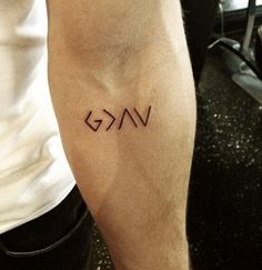 a man with a tattoo on his arm that reads vg and has the word vg written across it