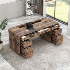 an office desk made out of pallets with drawers and a laptop computer on top