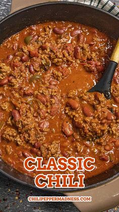 chili in a skillet with the words classic chili on it and an image of a spoon