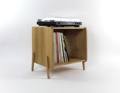 a record player on top of a wooden cabinet