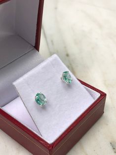 Featured here is a stunning set of oval Colombian emerald martini studs in fine .925 sterling silver. Displayed are light-green emerald with incredible transparency, accented by a simple four-prong silver mount, allowing for the emerald to be shown in full view. The earth mined, green Colombian emeralds have a desirable lush green color with excellent qualities. These earrings are ideal for everyday use and are the perfect accessory to any outfit. Approx Total Carat Weight: 1.0-carats Setting St Oval Birthstone Earrings For Formal Occasions, Oval Gemstones With Prong Setting For Gift, Oval Brilliant Cut Emerald Gemstones, Oval Cabochon Fine Jewelry Earrings For Gifts, Fine Jewelry Oval Cabochon Earrings For Gift, Fine Jewelry Oval Cabochon Earrings As Gift, Oval Sterling Silver Gemstones With Prong Setting, Oval Emerald Earrings For Anniversary, Oval Formal Birthstone Gemstones