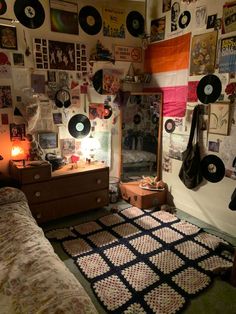 a bedroom with record records on the wall