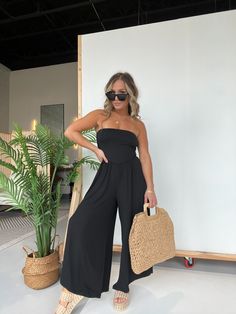 Details Butter Soft Tube Top Wide Leg Pointed Jumpsuit Color: Black Material: 96% Polyester/4% Spandex Size Runs True to Size Model is Wearing a Size Small Model Measurements Size: 4 Height: 5'2" Weight: 135lbs Bust: 35" Waist: 28" Hips: 37" Bra Size: 34C Chic Black Stretch Strapless Jumpsuit, Chic Black Strapless Stretch Jumpsuit, Chic Black Strapless Jumpsuit For Beach, Black Strapless Jumpsuit For Beach In Spring, Spring Black Strapless Jumpsuit For The Beach, Spring Black Strapless Jumpsuit For Beach, Black Strapless Jumpsuit For Beach In Summer, Black Strapless Jumpsuit For Summer Beach Outing, Black Strapless Jumpsuit For Summer Beach