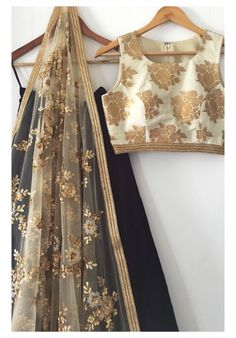 The Gold and Black Madison Lehenga Set White Choli With Sheer Dupatta For Transitional Season, Brocade Lehenga For Eid, Gold Brocade Set With Sheer Dupatta, Eid Brocade Lehenga With Sheer Dupatta, Reception Brocade Saree With Sheer Dupatta, Brocade Saree With Sheer Dupatta For Reception, Semi-stitched Brocade Lehenga, Party Choli With Sheer Dupatta For Transitional Season, White Art Silk Lehenga For Party