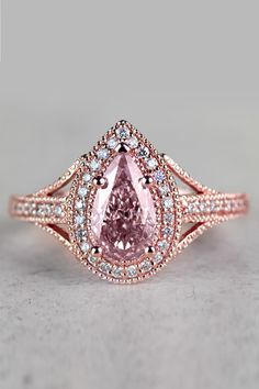 Nothing truly beats the radiance and sparkle of this vintage rose gold engagement ring. With the inclusion of a stunning 1 carat Pink Diamond, this engagement ring adds a luxurious color that will captivate the attention of all. Vintage Inspired Diamond Rings, Pink Diamonds Engagement, Pink Diamond Engagement Ring, Rose Gold Engagement Ring Vintage, Pink Diamond Ring, Peach Morganite, Vintage Rose Gold, Rose Gold Engagement, Rose Gold Metal