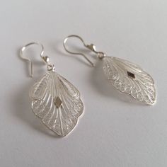 "Filigree Earrings Cordoba - Sterling Silver Earrings - Filigree Jewelry - Leaf Earrings - Handmade Silver Earrings - Gift Idea for Her Filigree - delicate jewellery technique made from silver or golden threads \"embroidering\" kind of metalwork lace that is specific to Spain, especially an Andalusian town Cordoba, where they call it a cordobese filigree. This craftsmanship has been passed from generation to generation, nonetheless nowadays there are very few craftsmen left who know to perform s Ornate White Dangle Earrings, Ornate White Pierced Earrings, White Intricate Design Dangle Earrings, White Intricate Drop Earrings, Classic Filigree Chandelier Earrings As Gift, Classic Filigree Chandelier Earrings For Gift, Ornate White Filigree Earrings, Elegant Silver Pierced Danglers, White Danglers With Intricate Design For Gift