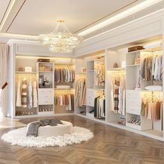 a walk in closet filled with lots of clothes and shoes on top of wooden flooring