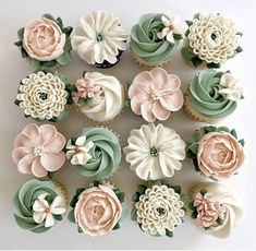 cupcakes decorated in pastel colors with flowers