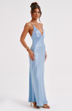 Made in our super luxe. bias cut hammered satin with a gorgeous sheen. the Anja maxi skims the body for a beautiful fit. The perfect dress to create memories in. it features a plunge V-shaped neck and delicate straps.   Colour: Turquoise. Luxury bias cut satin. Delicate straps. Skims over the figure. Plunge neckline. Maxi length. Model is an XS and is wearing an XS. Sleek V-neck Bias Cut Maxi Dress, Blue V-neck Bias Cut Maxi Dress, Blue Bias-cut Floor-length Maxi Dress, Turquoise V-neck Maxi Dress For Summer, Blue Maxi V-neck Beach Dress, Homecoming Dresses Corset, Midi Dress Wedding Guest, Colour Turquoise, Long Sleeve Homecoming Dresses