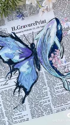 a blue butterfly sitting on top of a newspaper next to some white and purple flowers