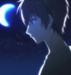 a man with short hair staring at the moon