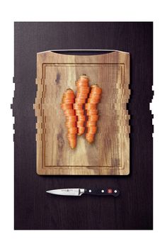 four raw carrots on a cutting board ready to be cooked