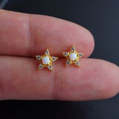 ⭐ Stunning fire opal star stud earrings in 925 sterling silver or gold. Opal is October's birthstone & 14th wedding anniversary. Perfect gift idea for October born and any special occasion ⭐  ◦ Material: 925 sterling silver ◦ Finish: Silver / Gold ◦ Size: 8x8mm   ◦ Comes in a lovely branded jewelry pouch - ready for gifting 🎁 ◦ Gift box can be added to your order separately before checkout 📦 P R O D U C T I O N  &  S H I P P I N G  ◦ Check individual items for dispatch times ◦ 1st class UK Roy Star-shaped Fine Jewelry Earrings For Gifts, White Star-shaped Earrings As Gift, Star-shaped White Earrings For Anniversary, White Star-shaped Earrings For Anniversary, White Star Earrings For Anniversary, White Celestial Star Earrings, Celestial White Star Earrings, October Born, 14th Wedding Anniversary