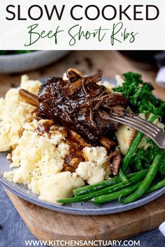 a plate with meat, mashed potatoes and green beans