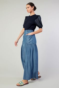 Hot days call for chambray. Put these beachy wide-leg pants on your essentials list. Designed with an elasticized waist, the pair has a loose, flowy silhouette with round pockets, tiered paneling, and gathered details. •Pull-on style •Partially elasticized waist •Round pockets •Tiered styling •Wide-leg silhouette DIMENSIONS •Standard: 30" Length of inseam Item number 2470066 Chambray Pants, Essentials List, Print Trends, Vacation Dresses, Sweater Sale, Short Jumpsuit, Hot Days, Sweater Blouse, Trending Dresses