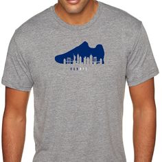 New York Running T-shirt Highlighting The New York City skyline within the Running Shoe design. Whether its training for a Marathon, 5K or just jogging down the street, this is the perfect NYC gift for your son, daughter, husband, wife, friend or anyone else that you know who loves running. RUNNYC NYC RUN © 2018 Folk That, LLC Athletic Heather Short Sleeve T-shirt For Running, Breathable Casual T-shirt For Sports Events, Urban Moisture-wicking Sports T-shirt, Casual Crew Neck T-shirt For Running, Casual Running T-shirt, Casual Athletic Fit T-shirt For Running, Casual Go-dry T-shirt For Streetwear, Breathable Casual T-shirt For Running, Casual Breathable T-shirt For Running