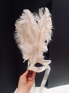 Butterfly mask- Mardi Gras-Halloween- Masquerade Ball Hi. This butterly mask is made with an plastic and glitter butterflies that are perched on the center of the mask. This white butterflies 5 inches wide. The mask has matching ostrich feathers in the center. Feather colors: All white All black Black and white mix Its on a matching tie that is adjustable to fit any head size and very comfortable. Will fit any adult. It's a cardboard molded over a plastic mask... makes it durable and then its pa Elegant White Masquerade Mask For Carnival, White Eye Mask For Halloween, White Masquerade Mask For Halloween, White Masks For Carnival Party, White Party Masks For Carnival, White Eye Mask For Costume Party, White Mardi Gras Masquerade Masks, White Carnival Party Mask, White Eye Mask For Masquerade