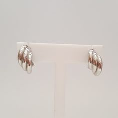 18kt White Gold Triple Hoop Earrings, Like New Condition, 19mm Long x 9.2mm Wide, 4.8 Grams, Friction Post w/ Omega Backing, Hollow. Beautiful earrings that are versatile and timeless in design. Stamped 750. 4.8 grams. Please let us know if you have any questions. Rock N Gold Estates has 30 years of experience selling fine estate jewelry. Simon M., owner and founder of Rock N Gold Creations, is a graduate of the Gemological Institute of America. Modern Clip-on Huggie Earrings, Modern Hallmarked Huggie Earrings, Modern Polished Clip-on Earrings For Anniversary, Modern Clip-on Hoop Huggie Earrings, Formal White Gold Clip-on Hoop Earrings, Modern Hallmarked Hoop Earrings, Modern Round Clip-on Earrings For Anniversary, Modern Polished Round Clip-on Earrings, Modern Polished Finish Round Clip-on Earrings