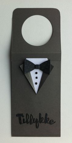 an origami style card with a tuxedo and bow tie on it