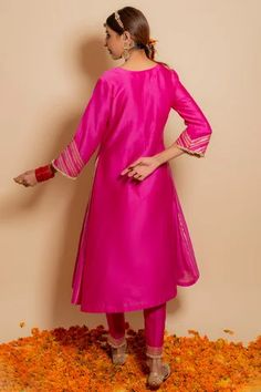 Fuchsia chanderi silk A-line kurta with embroidered gota details. Comes with embroidered pants. Paired with embroidered organza dupatta.
Component: 3
Pattern: Embroidered
Type Of Work: Gota,pearl,zardozi 
Neckline: Round
Sleeve Type: Three quarter
Fabric: Silk chanderi, organza, Lining: Cotton shantoon
Color: Fuchsia
Other Details: 
Kiran lined sleeves
Side gota embroidery panels
Lace embroidered bodice
Lining attached
Occasion: Mehendi and Haldi,Sangeet - Aza Fashions Pink Silk Kurta With Cutdana Detail, Pink Silk Kurta With Cutdana, Designer Pink Tussar Silk Kurta, Tussar Silk Straight Kurta Dress, Pink Silk Straight Kurta, Festive Pink Tussar Silk Kurta, Pink Art Silk Straight Kurta Dress, Designer Pink Tussar Silk Anarkali Set, Pink Tussar Silk Traditional Wear With Gota Work