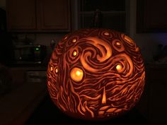 a carved pumpkin with candles in it