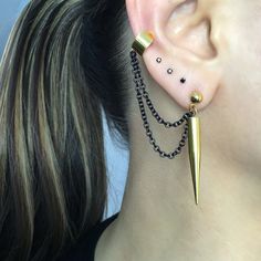 Simple yet edgy Spike earrings and cuff are made of 316L Stainless steel . Can be purchased as single or a pair. Spike earrings 1 3/4 inches long Cuff is 6mm wide Short chain 1 3/4 inches All items are shipped in a gift box Gold Dangle Punk Jewelry, Gold Punk Dangle Jewelry, Edgy Earrings With Ear Wire For Parties, Pierced Drop Cartilage Earrings For Party, Punk Style Pierced Ear Cuff For Party, Black Metal Stud Jewelry, Gold Single Earring Punk Style, Edgy Pierced Drop Earrings, Edgy Pierced Metal Earrings