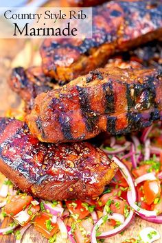 grilled meats and vegetables on a cutting board