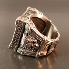 Fenris Skull Tomb Ring Silver Silver biker rocker style skull ring with gothic architectural details, black crystals.Metal: Silver alloySize: 10 Includes velvet gift bag. Need a gift box? We have those too! Mens Skull Rings, Silver Skull Ring, Rocker Style, Architectural Details, Skull Ring, Black Crystals, Ring Silver, Gift Bag, Rocker