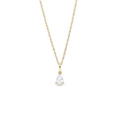 a gold necklace with a white diamond on it