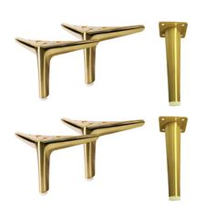 three brass colored metal brackets on white background