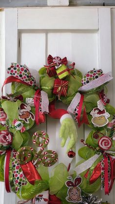 a christmas wreath with candy canes and decorations