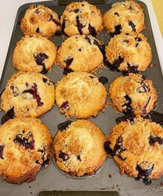 blueberry muffins in a baking pan ready to be eaten