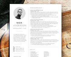 a professional resume is shown on top of a wooden table