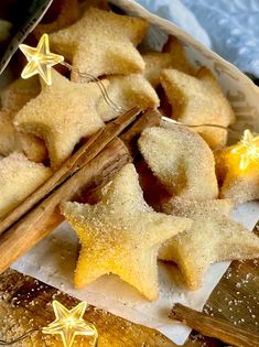 star shaped cookies and cinnamon sticks on a table