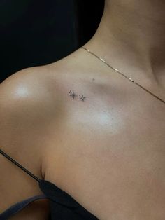 a woman with a star tattoo on her chest