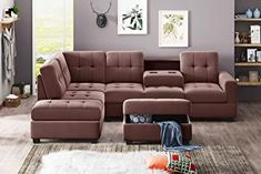 a living room scene with focus on the sectional sofa and footstool in the foreground