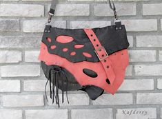 This bohemian bag is made of genuine  thick cowhide leather in peach pink and black.  Closure is zipper. There are 1 zippered pocket inside and lined butterfly patterned cotton fabric.  All sewings are handmade  carefully.  Its  inner width is 34 and height is 25 cm. Thickness is 6 cm. (13,4'' x9.8'' x 2.4'' ) Please note that color may vary according to monitor color calibrations. If you have any question, please don't hesitate me to ask whatever you want know. Handmade Leather Black Hobo Bag, Handmade Black Leather Hobo Bag, Black Pouch Shoulder Bag For Festivals, Festival Soft Leather Crossbody Shoulder Bag, Pink Rectangular Leather Hobo Bag, Rectangular Pink Leather Hobo Bag, Pink Leather Rectangular Hobo Bag, Leather Hobo Bag Crossbody For Festival, Leather Crossbody Hobo Bag For Festivals