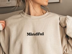 This mindful positive affirmation sweatshirt is the perfect way to encourage mindfulness in your life. Whether it's for yoga, meditation, or just lounging at home, this hoodie has everything you need to stay fashionable, comfortable, and mindful. The meaningful affirmation ‘breathe in breathe out’ on the sleeve helps to remind us that, despite whats happening in our life, staying focused on the present is the best we can do. An excellent wellness-inspired gift for yourself or a loved one, this s Oversized Crew Neck Sweatshirt For Relaxation, Athleisure Relaxed Fit Sweatshirt For Relaxation, Relaxed Fit Athleisure Sweatshirt For Relaxation, Fall Relaxation Crew Neck Sweatshirt, Fall Crew Neck Sweatshirt For Relaxation, Relaxed Fit Cotton Sweats For Relaxation, Cotton Athleisure Sweatshirt For Relaxation, Cozy Fit Athleisure Sweatshirt For Relaxation, Oversized Athleisure Sweatshirt For Relaxation