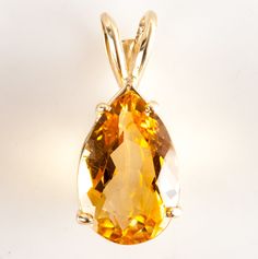 14k Yellow Gold Pear Citrine Solitaire Style Pendant 5.5ct 2.54g Metal Information: 14k Yellow Gold Total Weight: 2.54g Width: 10 MM Length: 23 MM Made By: Badavici Jewelry Stone Information Main StoneGem Type: Citrine Shape: Pear (15 x 10mm) Color: Orange Clarity/Quality: A Carat Weight: 5.5ct Number of Stones: 1 Total estimated ctw (carat total weight): 5.5ctw Estimated Retail Price: $1030.00 OUR PRICE: $825.00 44318 Yellow Gold Teardrop Gemstones For Anniversary, Anniversary Yellow Gold Teardrop Gemstones, Yellow Gold Teardrop Gemstone, Pear-shaped Yellow Gold Gemstones For Gifts, Gold Pear-shaped Citrine Jewelry, Yellow Gold Pear-shaped Citrine Jewelry, Pear-shaped Citrine Jewelry In Yellow Gold, Citrine Teardrop Pendant Jewelry, Yellow Pear-shaped Gemstone Jewelry