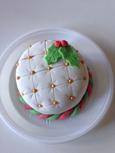 a decorated cake sitting on top of a white plate