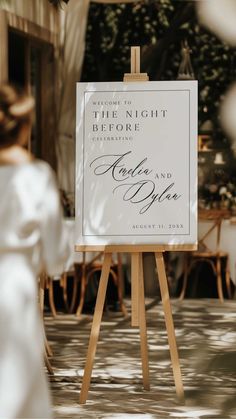 an easel with a sign that says, welcome to the night before wedding ceremony