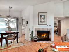 a dining room table with chairs and a fire place