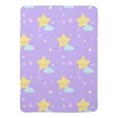 a purple notebook with stars and clouds on it