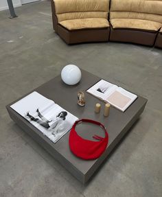 a coffee table with a red bag on it