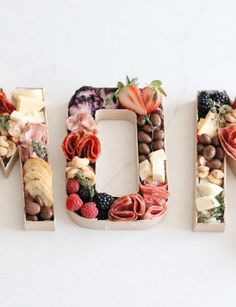 the word food spelled out with fruits and vegetables