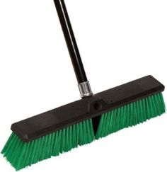 a black and green broom on a white background